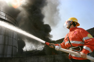 Firefighter Putting Out Fire